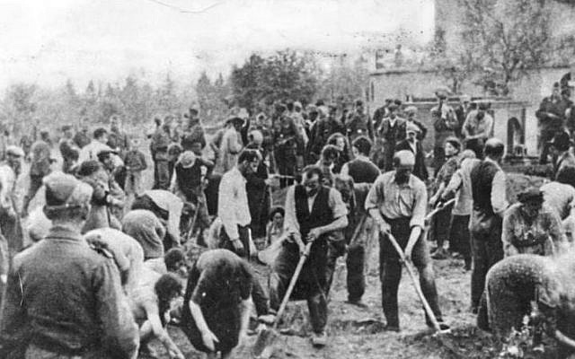 Jews being forced to dig their own graves in Storow, Ukraine, July 1941